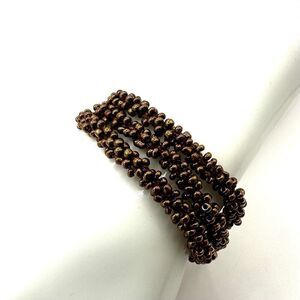 Gold tone multi strand beaded bracelet